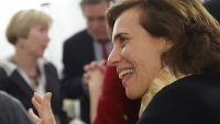 CPTR Faculty Member smiles during discussion at event.